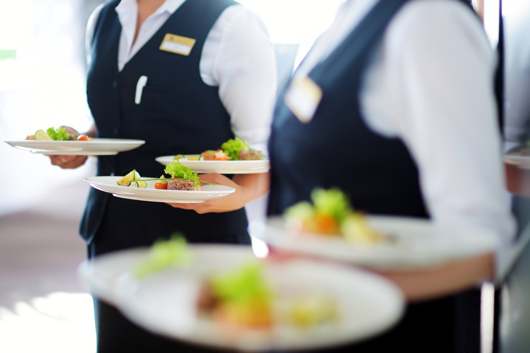 Waiter Carrying Plates