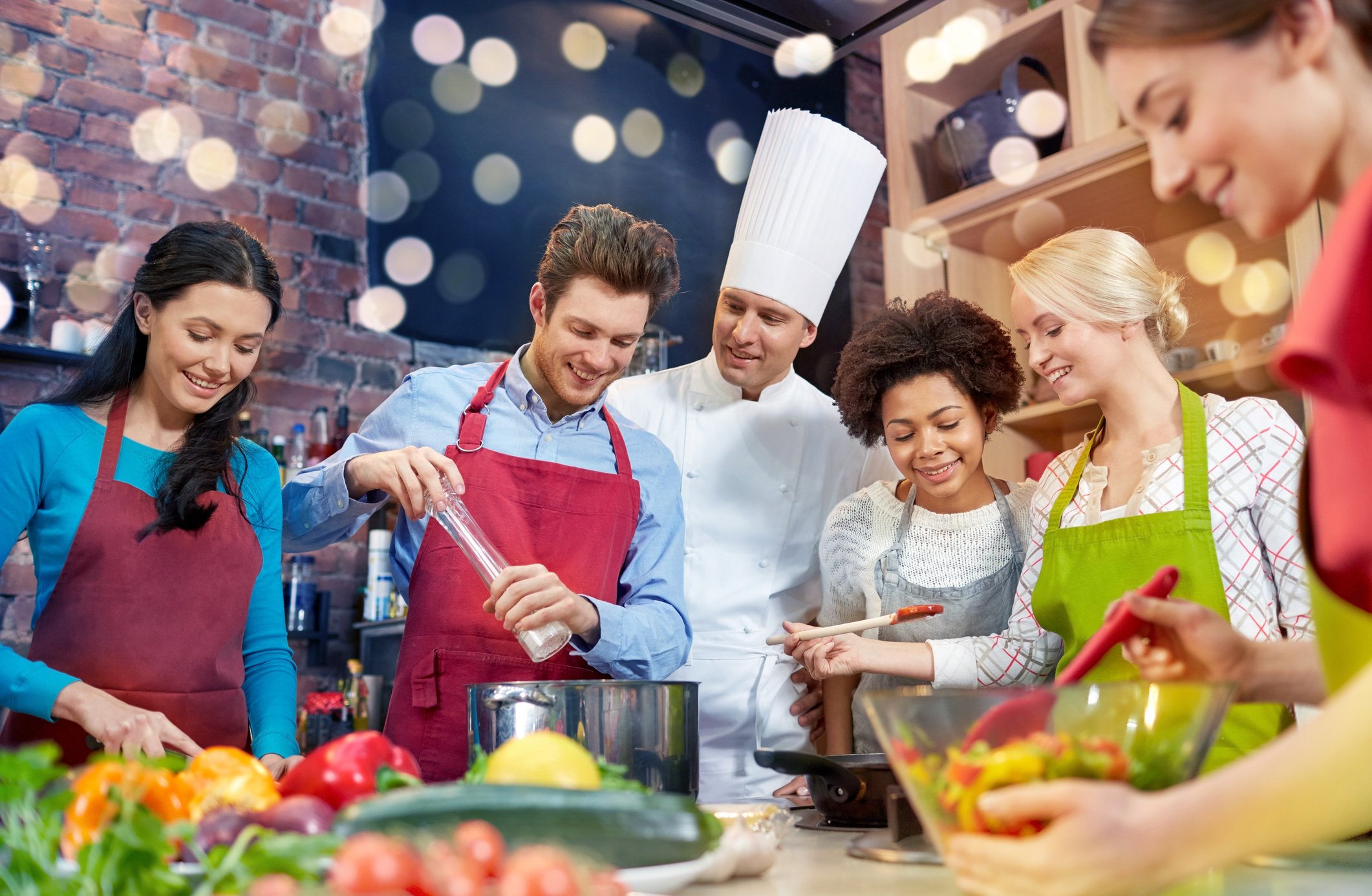 Happy Friends and Chef Cook Cooking in Kitchen